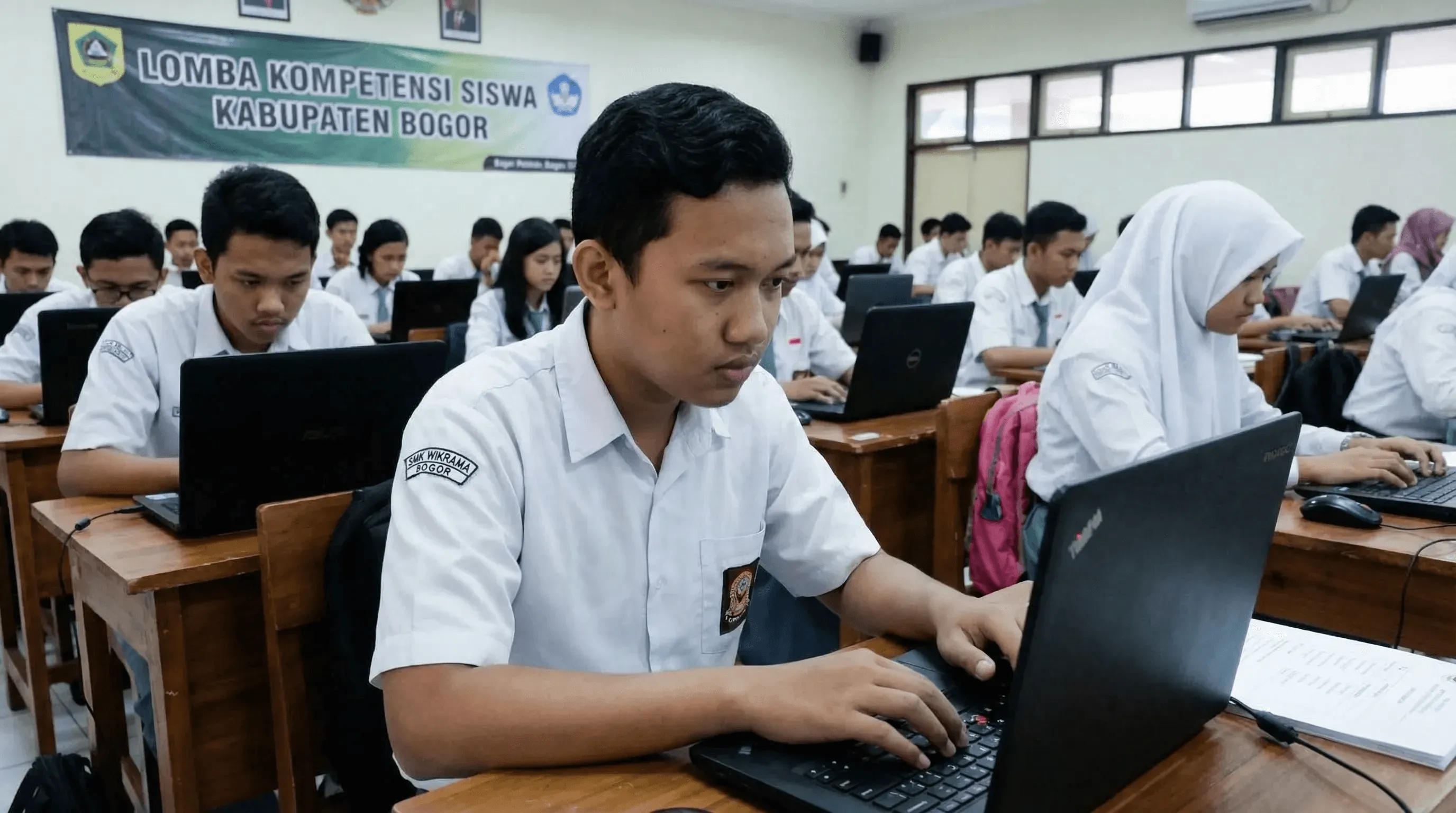 person discussing while standing in front of a large screen in front of people inside dim-lighted room